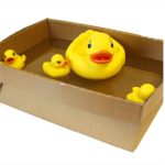 A box with three rubber ducks in it